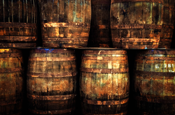 Stacked pile of old whisky barrels